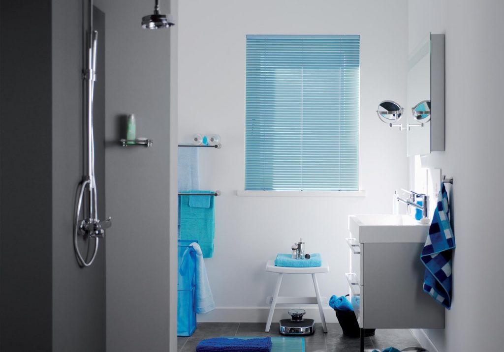 blue venetian blinds in white bathroom